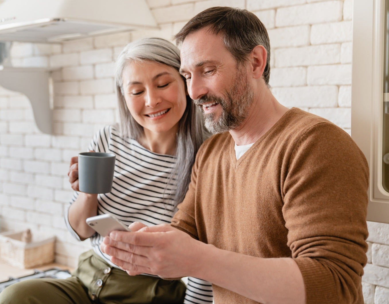 Morning couple looking at phone