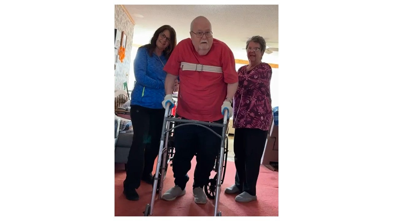 elderly man on a walker
