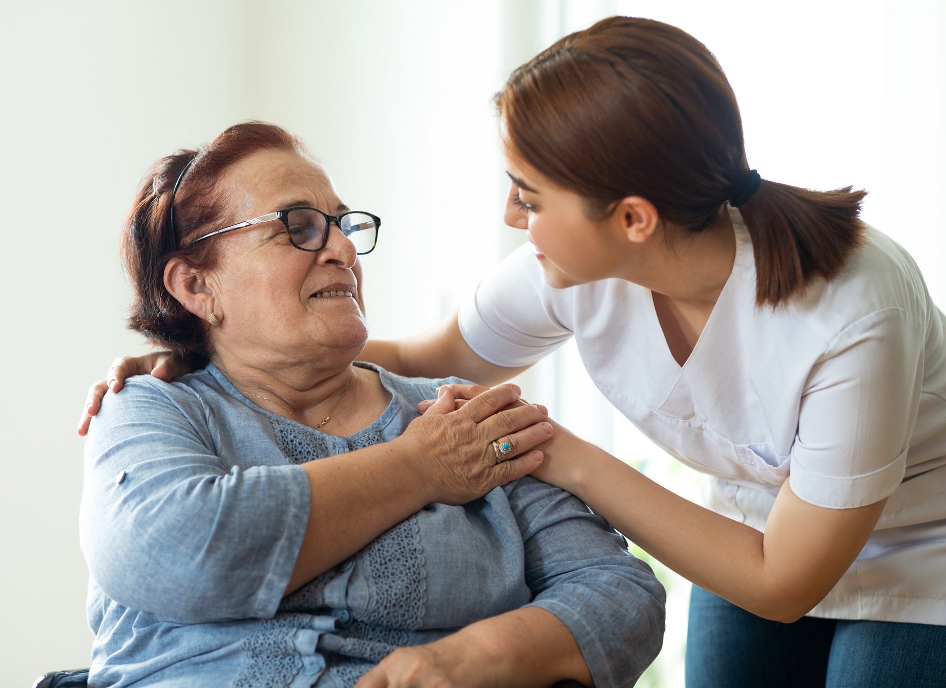 Caregiver with palliative care patient.
